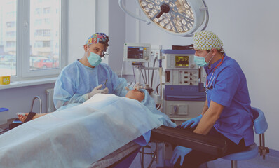 Man surgeon at work in operating room