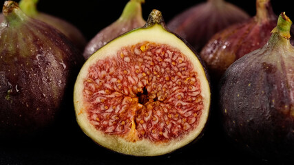 fresh cut figs close up on black background