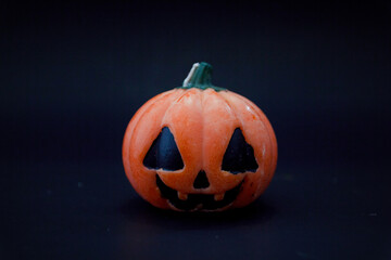 Halloween pumpkins on the black paper background. Halloween background. Space for text. copy space.