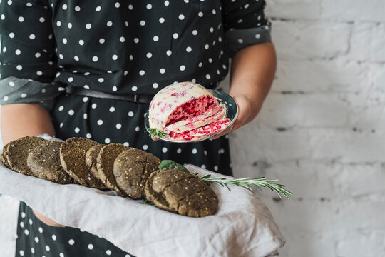 Woman Holding Tray With Bannocks and Butter