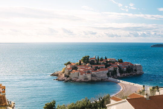 island of monastery sveti stefan at sunset from above, montenegro