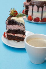 Piece of homemade chocolate cake decorated with fresh strawberries