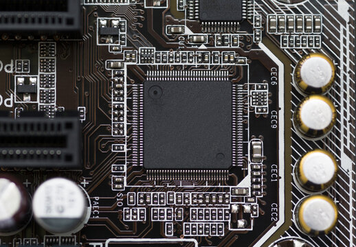 Close-up of electronic circuit brown board background of computer motherboard