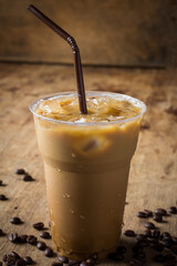 Cold coffee on wooden table.