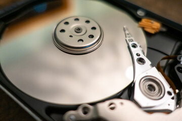 Fototapeta na wymiar internal moving parts and electronics of a typical disc hard drive
