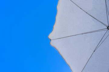 Beach umbrella with sky background