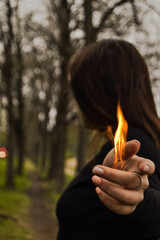 person holding a burning match