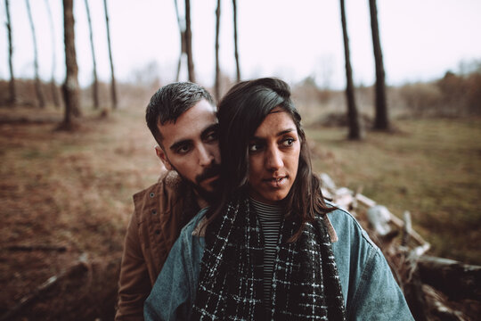 lovely interracial couple in the forest
