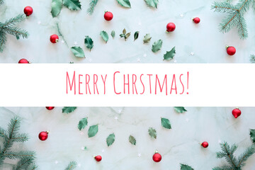 Text Merry Christmas. Marble stone background. Xmas background with natural fir twigs, holly leaves...