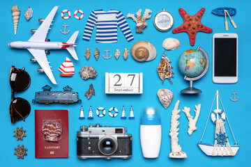 Happy world tourism day. Touristic objects, smart phone, passport, photo camera, sunglasses and...