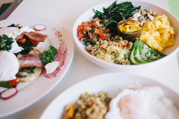 Healthy breakfast dishes with eggs and vegetables