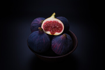 Tasty figs on a black background. Top view.