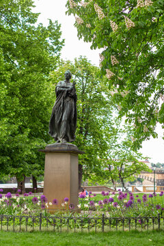 Monument to Bozena Nemcova in a beautiful city park in Prague