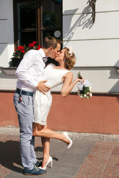 Young stylish couple in love posing on the street. Wedding photo