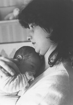 Woman holding her newborn son