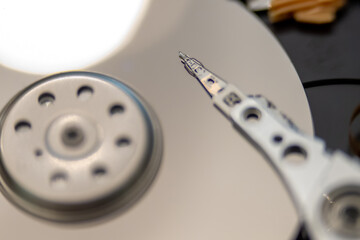 Fototapeta na wymiar internal moving parts and electronics of a typical disc hard drive