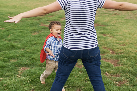 Mom playing with her son in the park