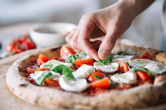 Woman cooking homemade pizza