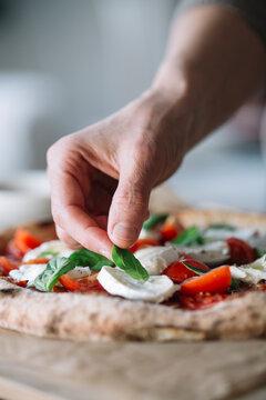 Woman cooking homemade pizza
