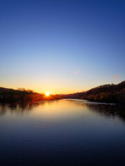 Fototapeta na wymiar River and Sun Setting 