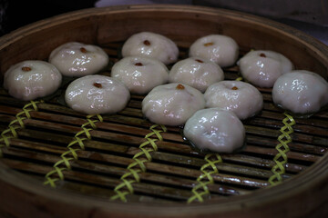 Rows of delicious Chinese dumplings in a bamboo basket, Hong Kong style
