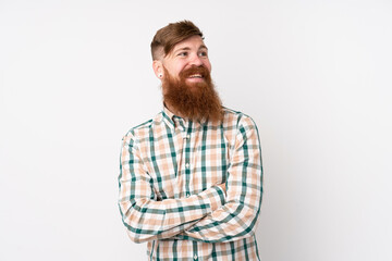 Redhead man with long beard over isolated white background with arms crossed and happy
