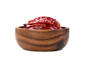 red ground paprika or dry chili pepper in wooden bowl isolated on white background