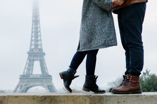 Couple kissing on the background of the Eiffel Tower