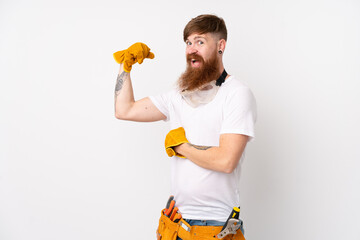 Redhead electrician man with long beard over isolated white background making strong gesture