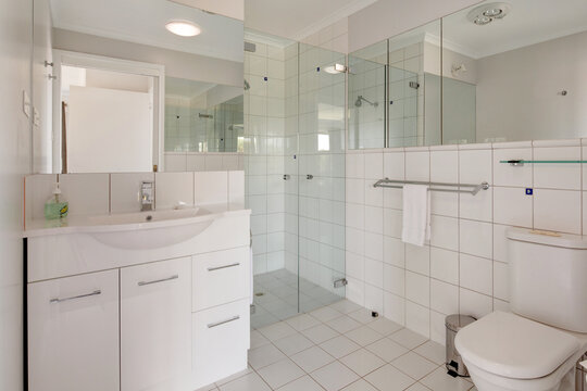 Contemporary white tiled bathroom