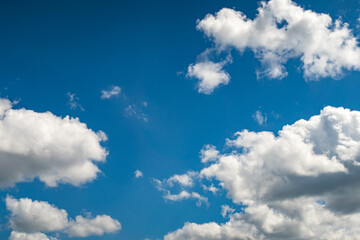 Blue sky background with a tiny clouds
