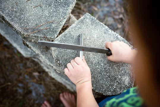 A Child Learns To Start A Campfire