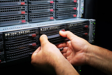 IT expert working on supercomputer block