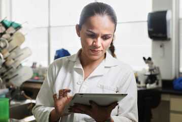 Lab professional using a tablet