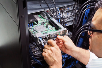 IT expert checking supercomputer server