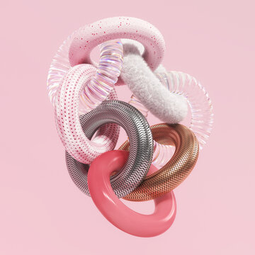 Intertwined rings made of different materials