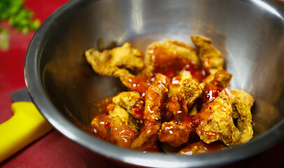 Fried chicken strips in fast food restaurant.Delicious poultry meat stripes cooked in deep fryer