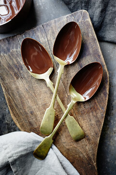 Three spoons, dipped in chocolate