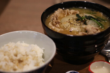 Close up of a bowl of delicious grilled onion and beef miso soup, Hiroshima, Japan