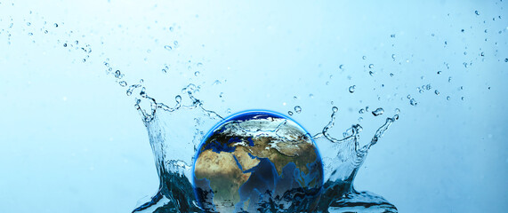 Water splash with Earth on blue background