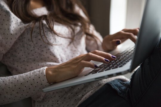 Woman working on her laptop from home
