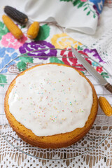 Traditional Romanian or Moldovan corn pie malay, with icing on a light background. Rustic style.