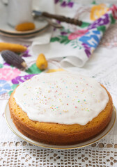 Traditional Romanian or Moldovan corn pie malay, with icing on a light background. Rustic style.