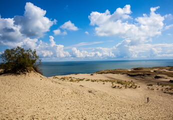 Fototapeta na wymiar Sand dunes against the backdrop of the lagoon