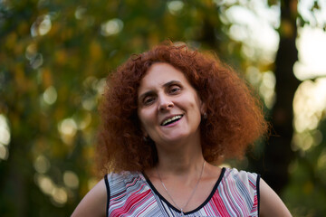 Curly redhead in the countryside