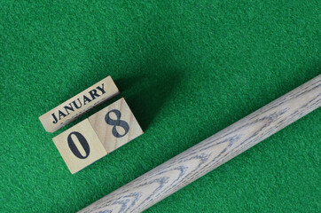 January 8, Number cube With a snooker stick on a green background, snooker table.