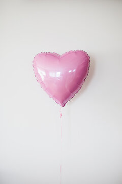 Heart-shaped pink balloon