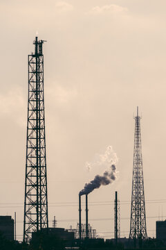 Smoke raising from factory chimneys