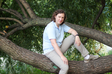 person sitting on tree
