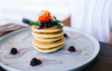 Yummy pancakes with berries and strawberry